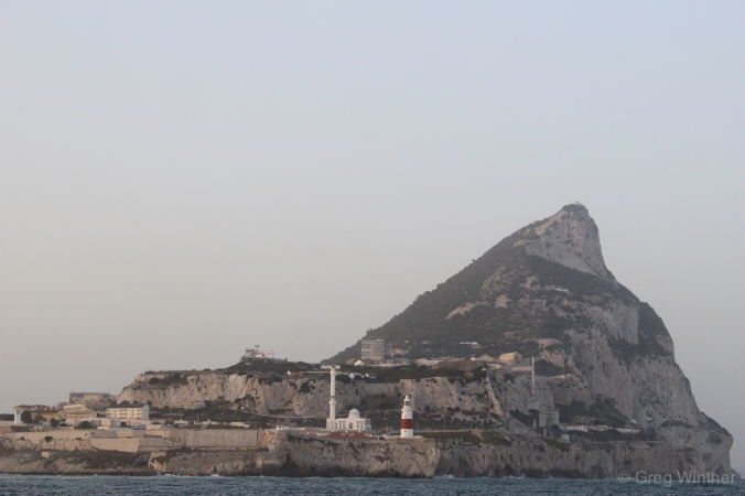 Europa Point with a lighthouse and mosque in the foreground and The Rock in the background.